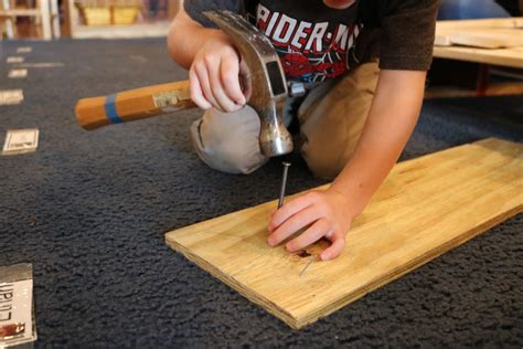 kid hammers metal box into fist|Woodworking With Children .